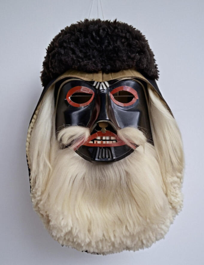 romanian folk art ceremonial mask resembling darth vader with a fluffy white beard